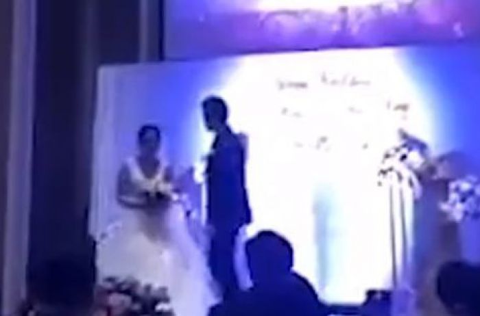 В Китае мстительный жених опозорил неверную невесту во время свадьбы. ВИДЕО
